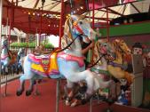 You can even have a ride on a wooden carousel horse.
