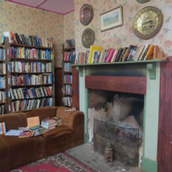 This would be a lovely cosy place to sit near the fire to browse through the books